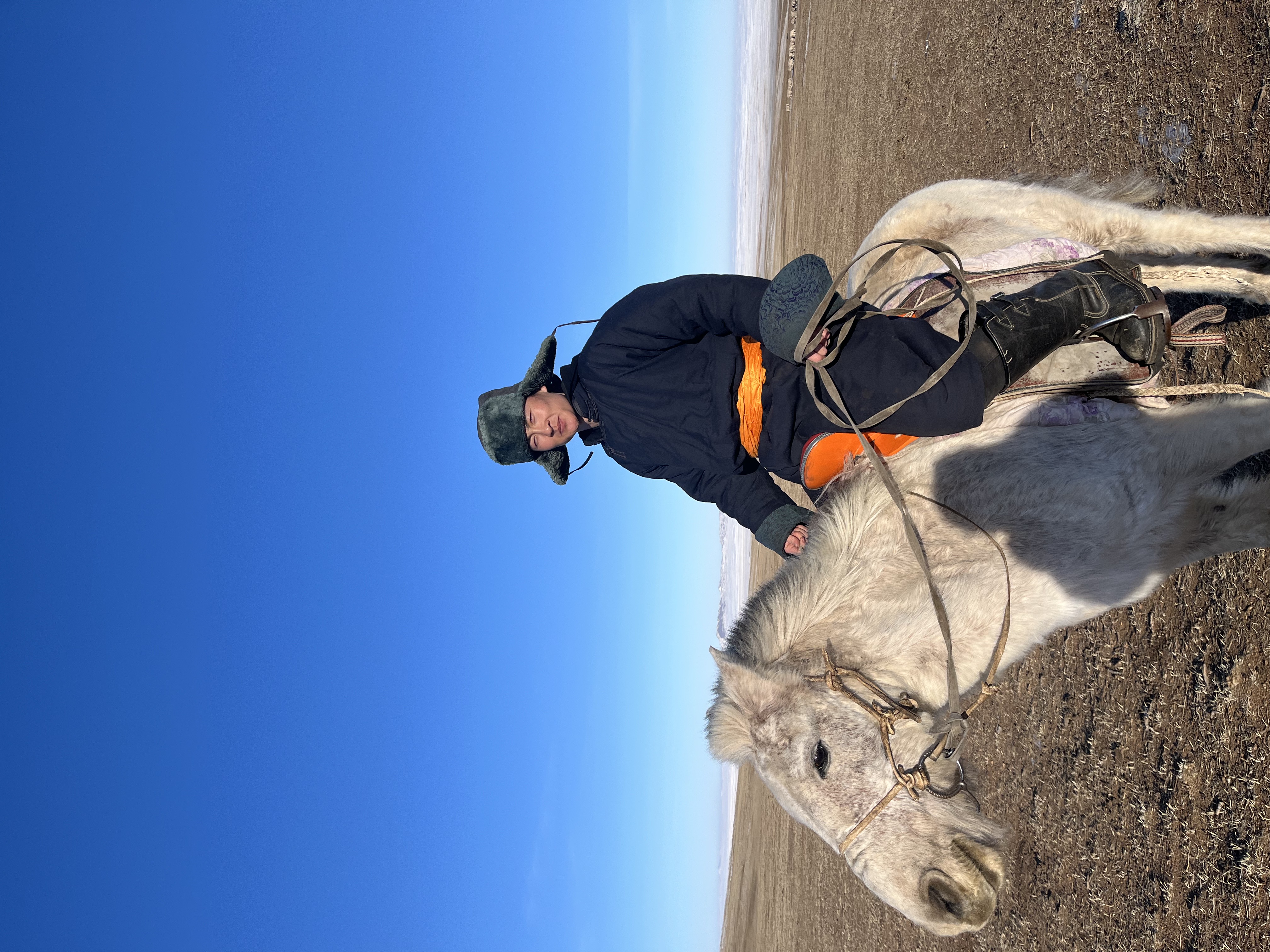 Jargal with a horse in the countryside